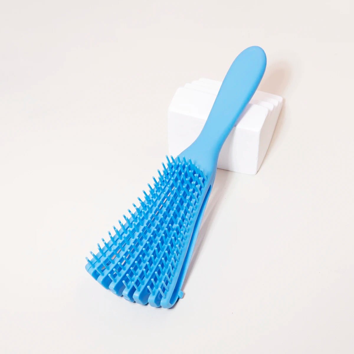 brosse cheveux boucles bleu