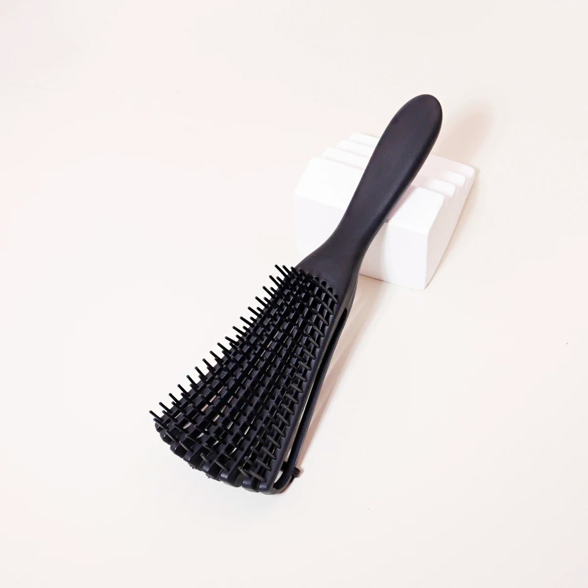 brosse cheveux boucles noire