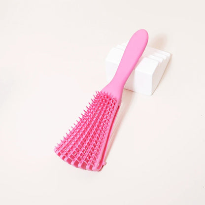 brosse cheveux boucles rose