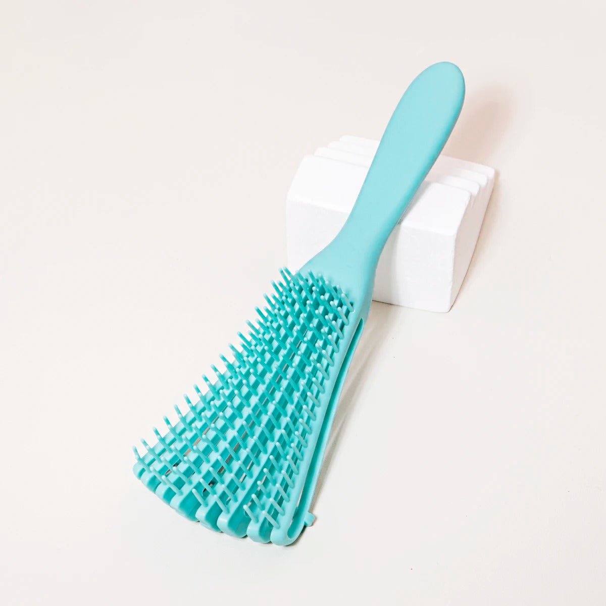 brosse cheveux boucles turquoise