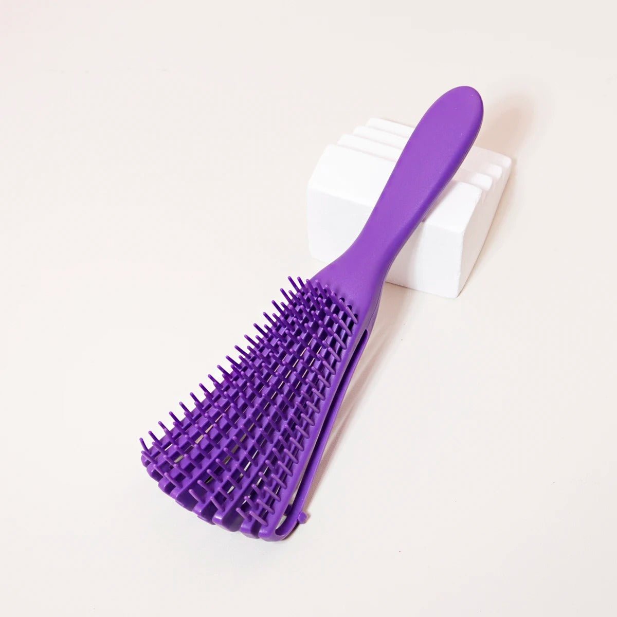 brosse cheveux boucles violet